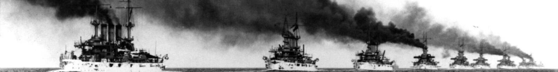 A large boat in the ocean under cloudy skies.